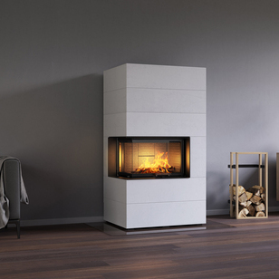 Holz-Kamin VISIO 2 ELEMENT eingebaut in weiss gestrichenen Betonelementen neben Sofa und Sideboard